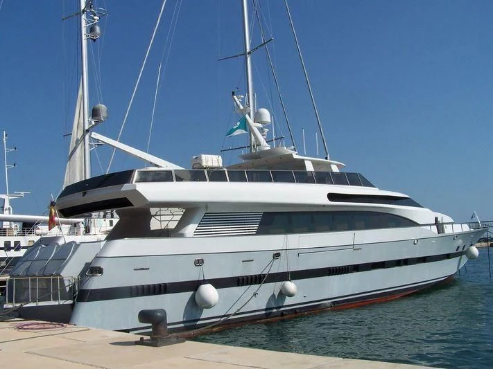 a white yacht on a dock aboard FONERS Yacht for Sale