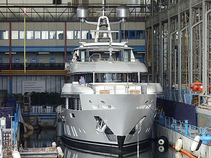 a large white boat in a warehouse aboard E.MOTION+ Yacht for Sale