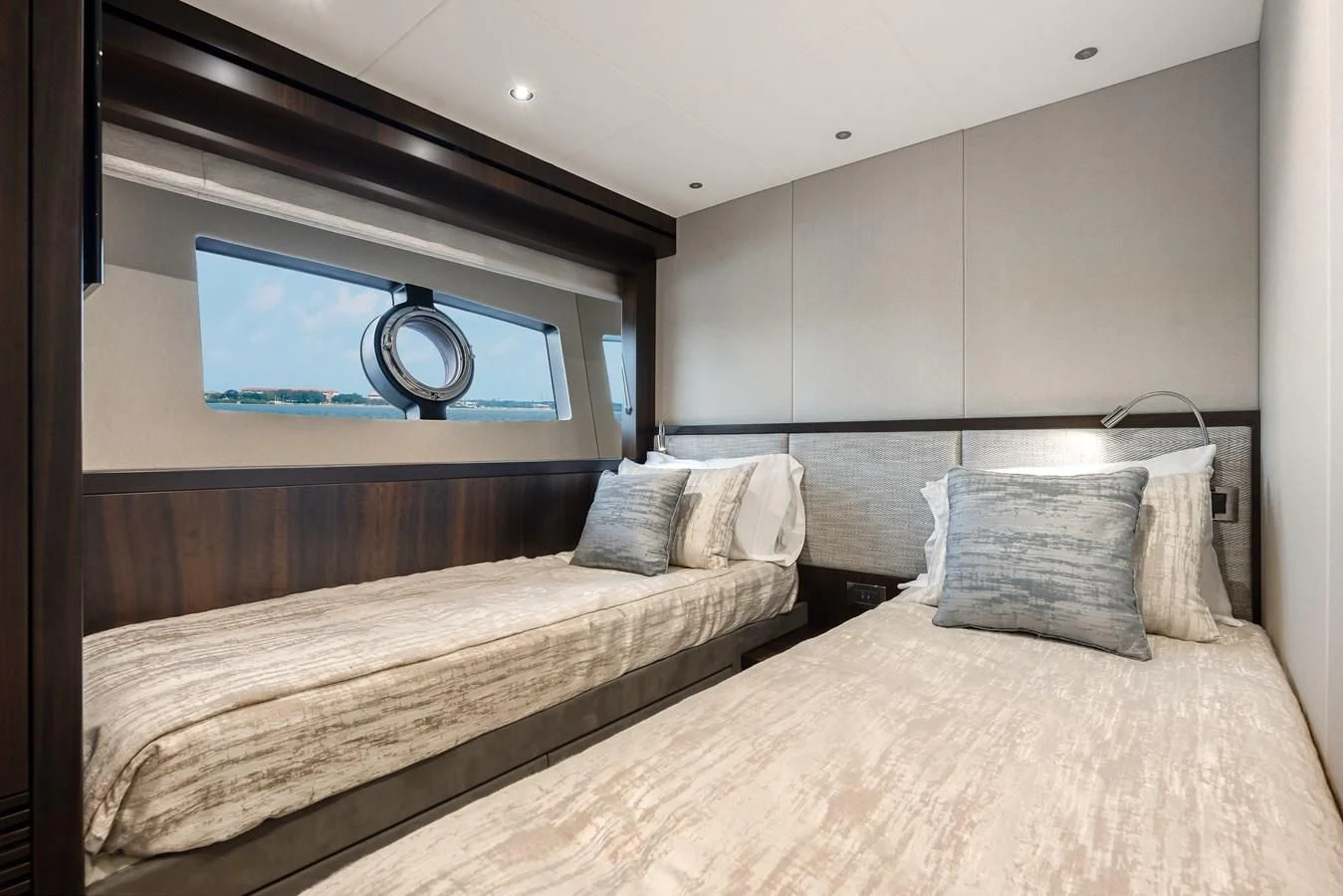 a room with a bed and a television aboard TRIGGER HAPPY Yacht for Sale