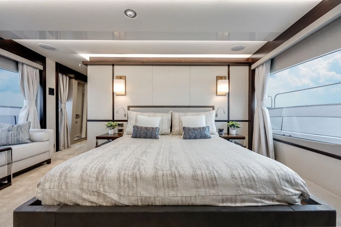 a large bed in a hotel room aboard TRIGGER HAPPY Yacht for Sale