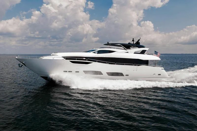 a white yacht on the water aboard TRIGGER HAPPY Yacht for Sale