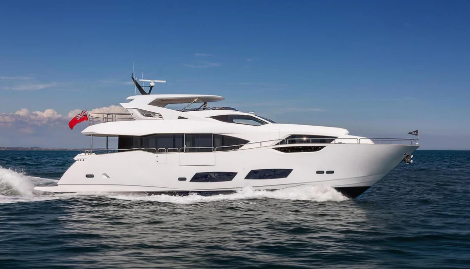 a white yacht on the water aboard TRIGGER HAPPY Yacht for Sale