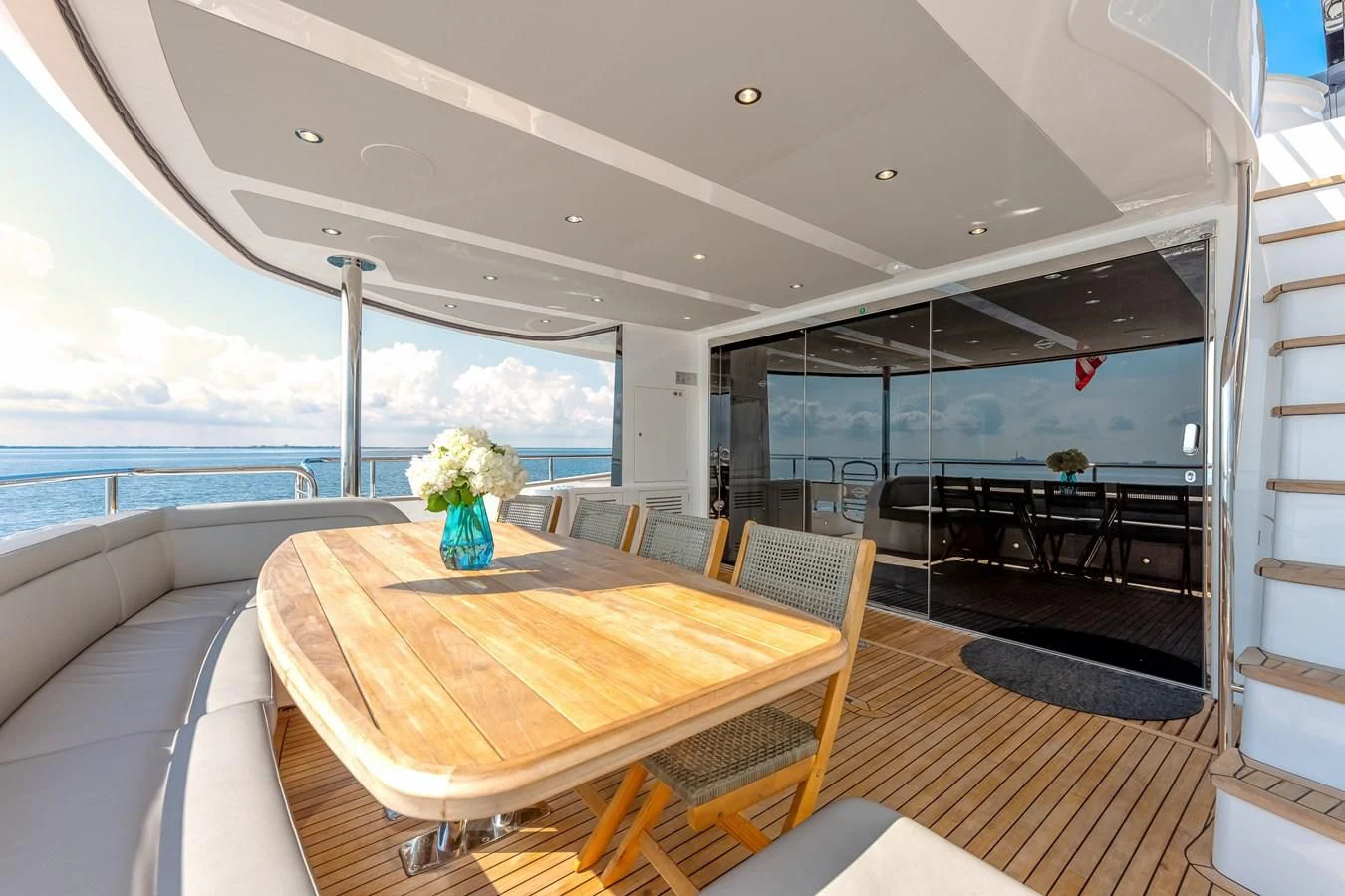 a dining table on a boat aboard TRIGGER HAPPY Yacht for Sale