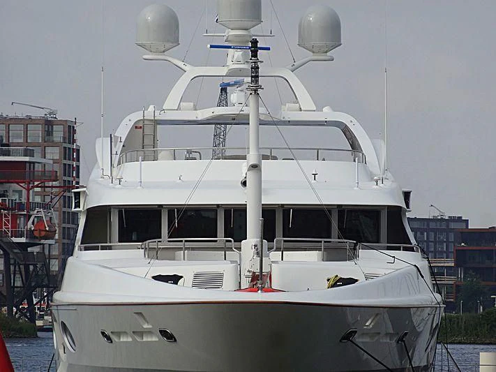 a white yacht in a harbor aboard LADY BRAVE Yacht for Sale