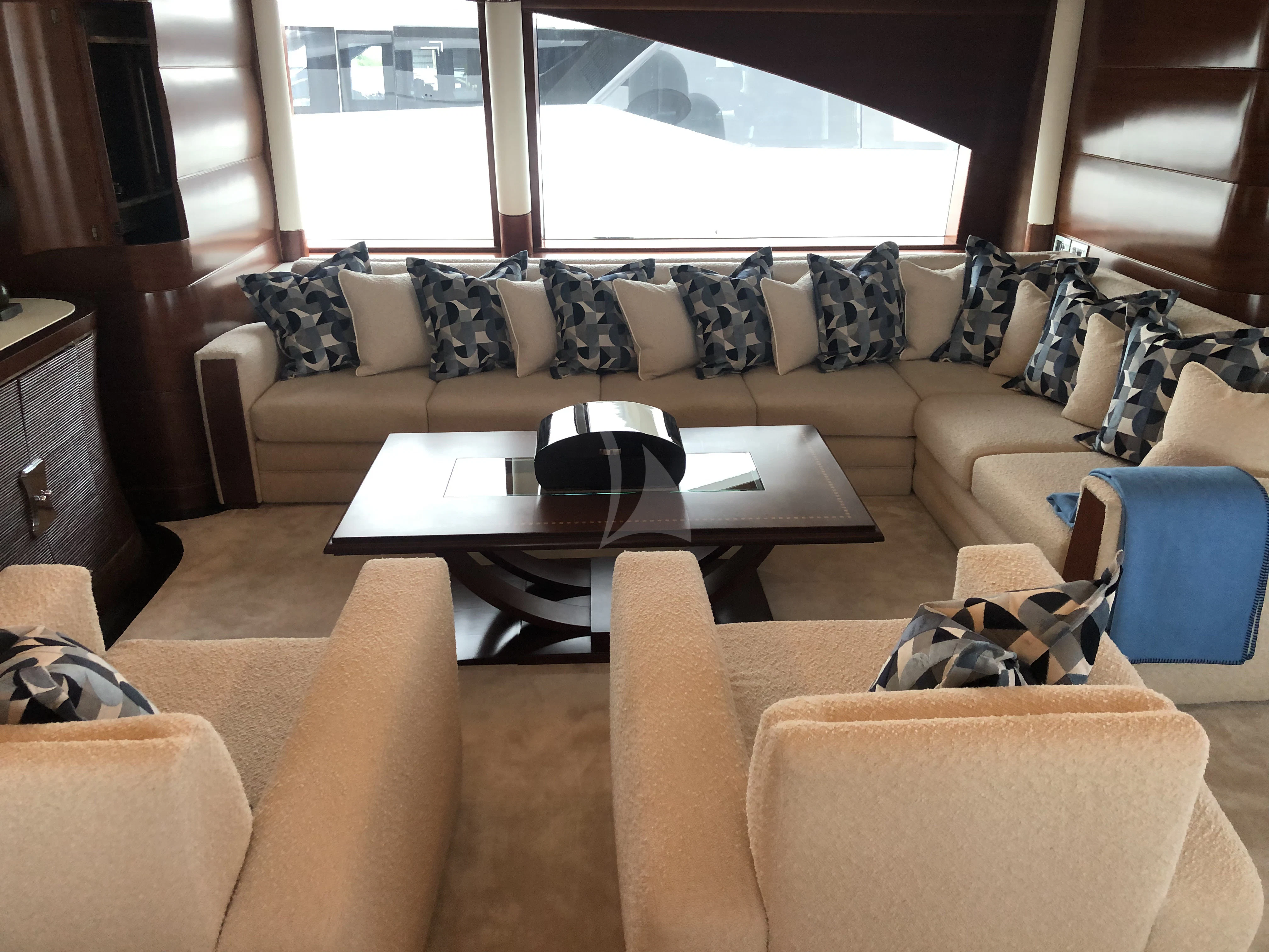 a living room with a couch and a coffee table aboard LADY BRAVE Yacht for Sale