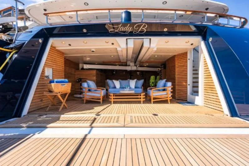 a wood deck with a wood deck and a sign on it aboard LADY BRAVE Yacht for Sale