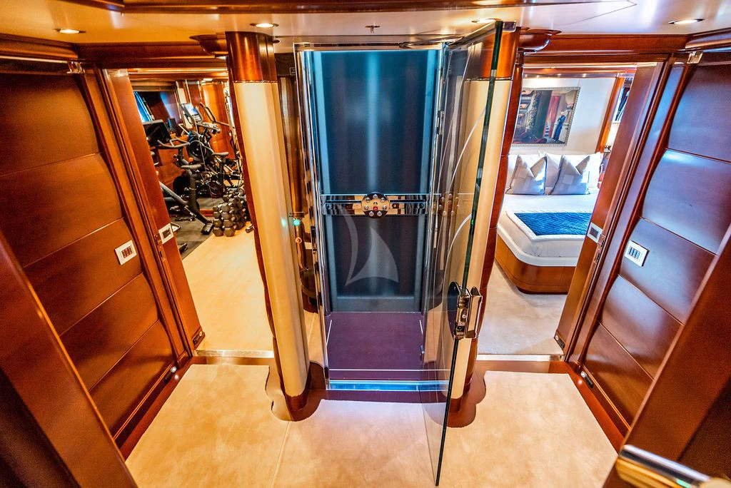 a room with a blue door and a metal frame aboard LADY BRAVE Yacht for Sale