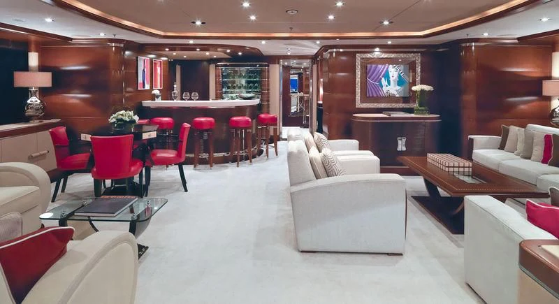 a room with a couch and chairs aboard LADY BRAVE Yacht for Sale