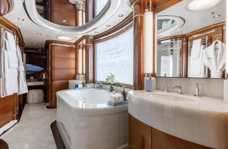 a bathroom with a large mirror aboard LADY BRAVE Yacht for Sale