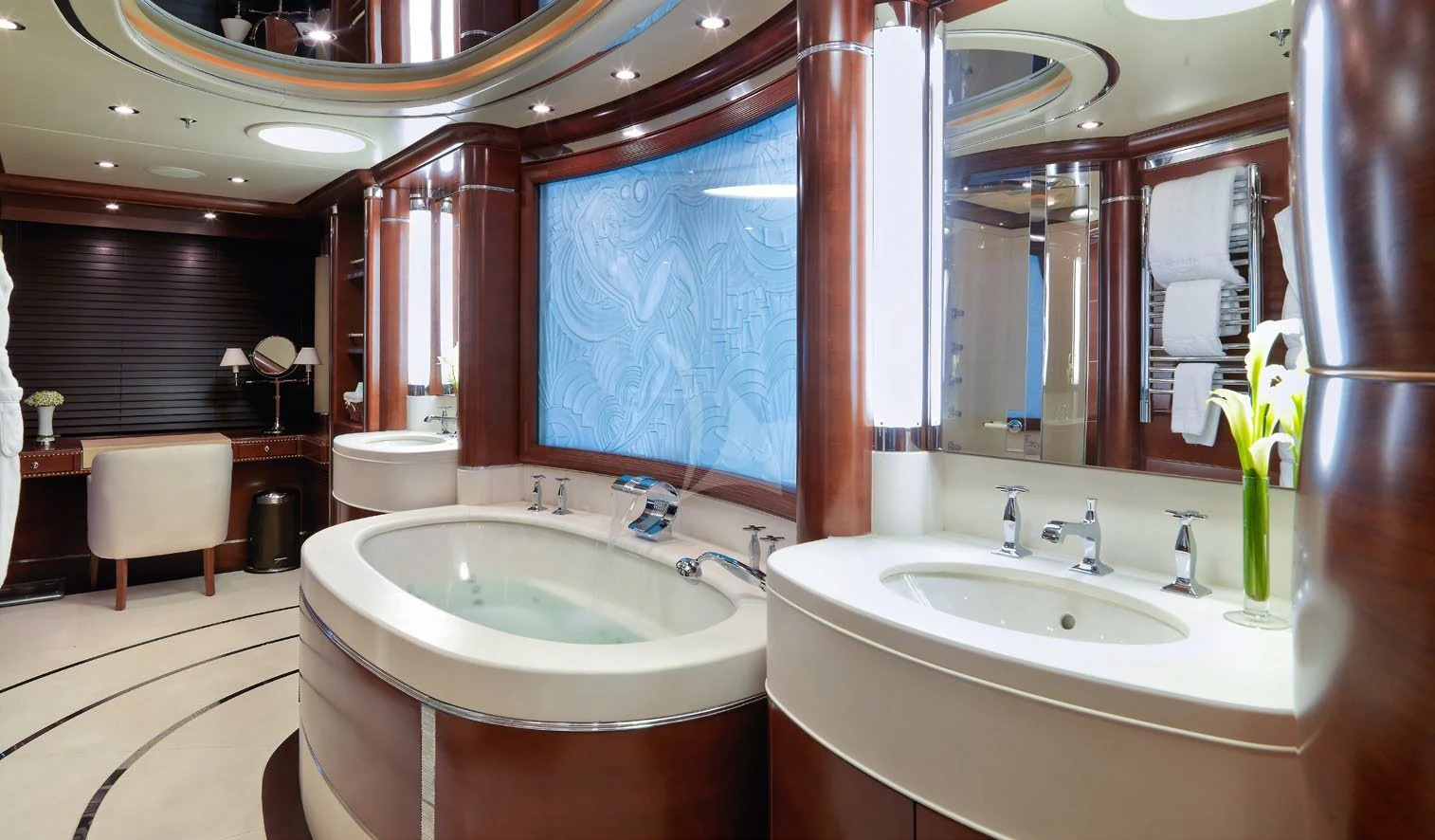 a bathroom with two sinks and a large mirror aboard LADY BRAVE Yacht for Sale