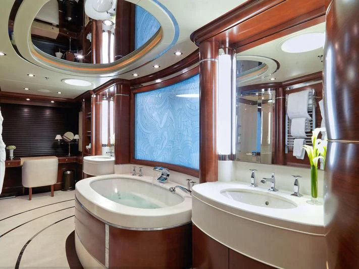 a bathroom with a large mirror aboard LADY BRAVE Yacht for Sale