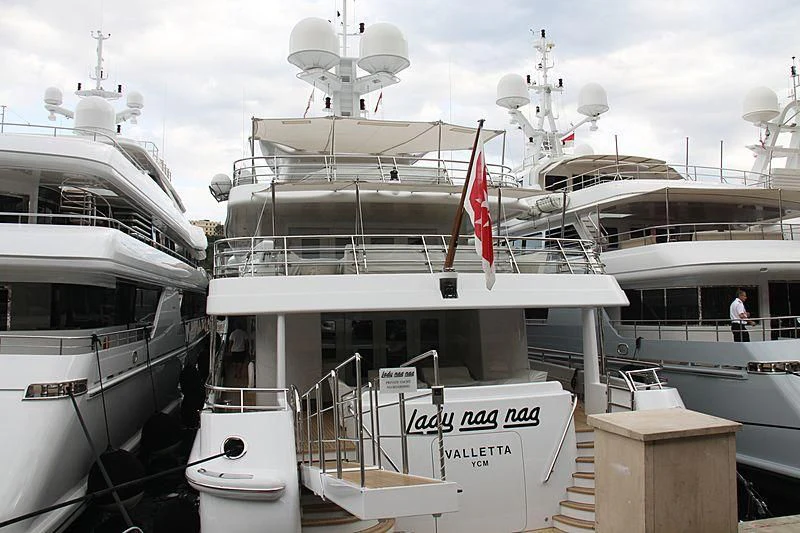 a large white ship with a red and white flag on the front aboard LADY BRAVE Yacht for Sale