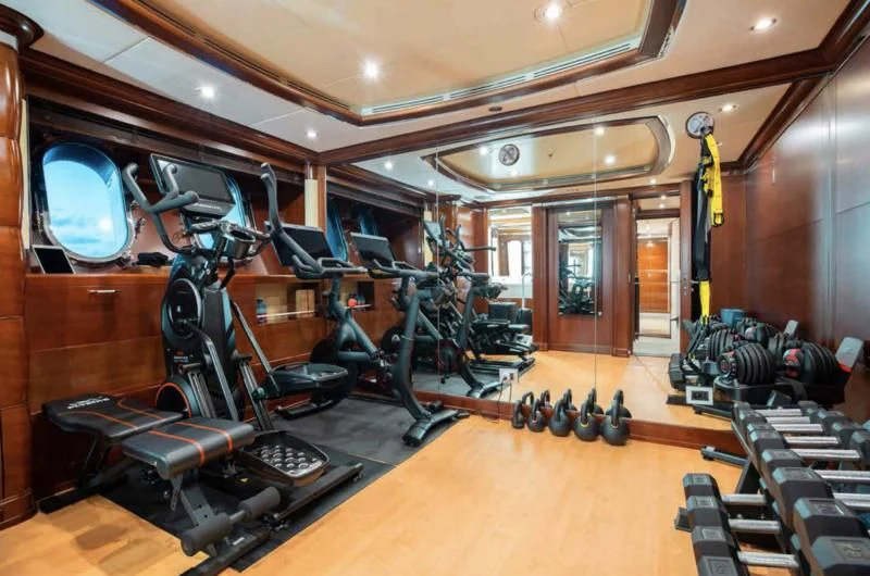 a gym with exercise equipment aboard LADY BRAVE Yacht for Sale