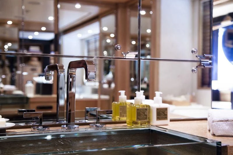 a bathroom with a large mirror aboard LADY BRAVE Yacht for Sale
