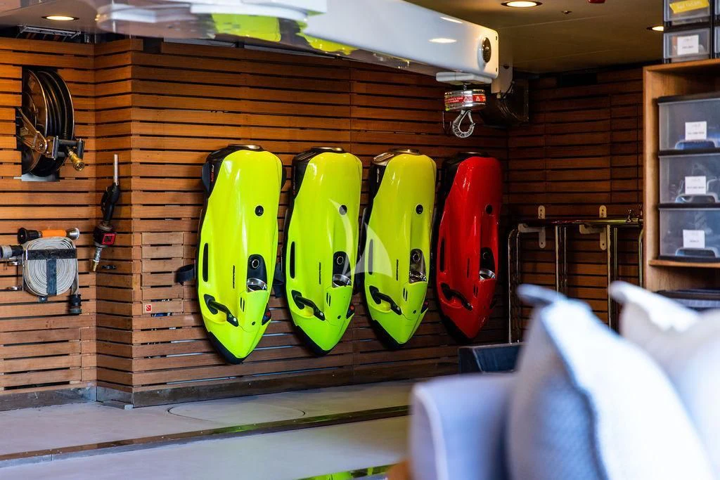 a group of skateboards are on a wall aboard LADY BRAVE Yacht for Sale