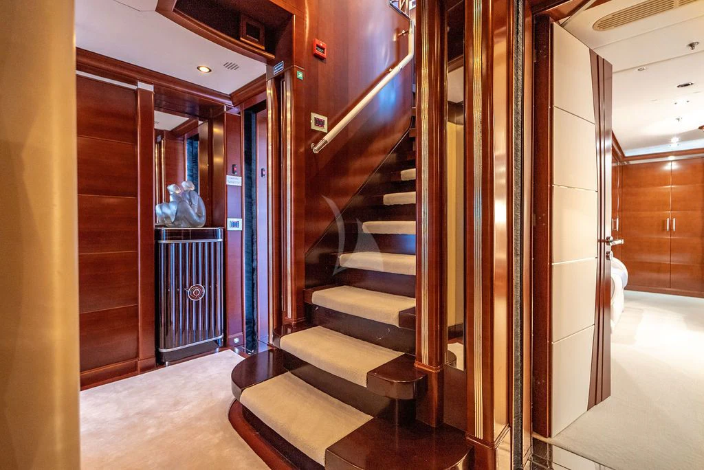 a hallway with a set of stairs aboard LADY BRAVE Yacht for Sale