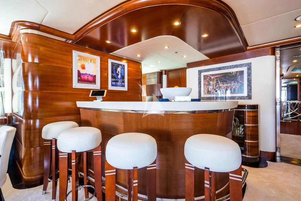 a bar with stools and stools aboard LADY BRAVE Yacht for Sale