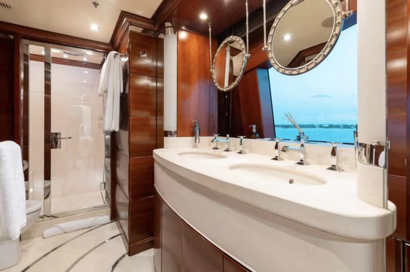 a bathroom with a large mirror aboard LADY BRAVE Yacht for Sale