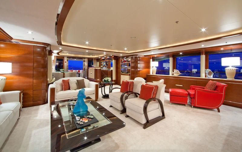 a room with a couch and a table and chairs aboard LADY BRAVE Yacht for Sale