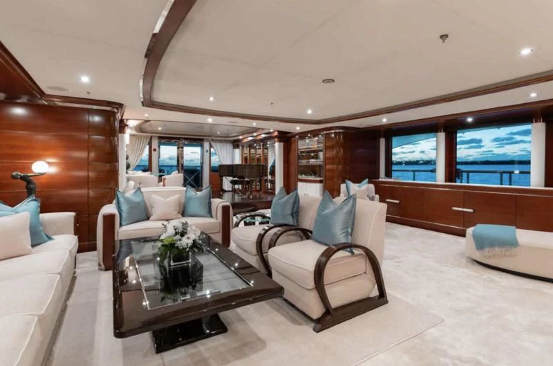 a living room with a couch and a coffee table aboard LADY BRAVE Yacht for Sale