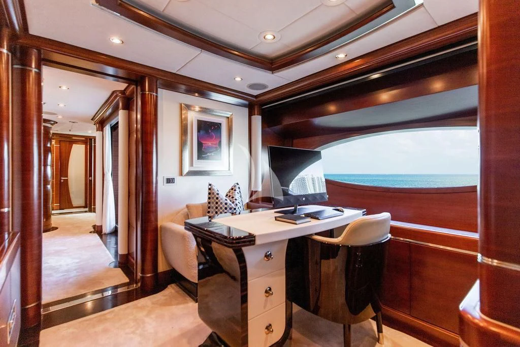 a room with a desk and a window aboard LADY BRAVE Yacht for Sale