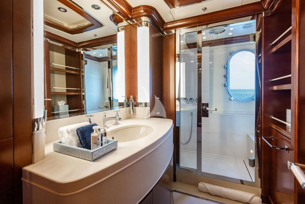 a bathroom with a sink and a mirror aboard LADY BRAVE Yacht for Sale