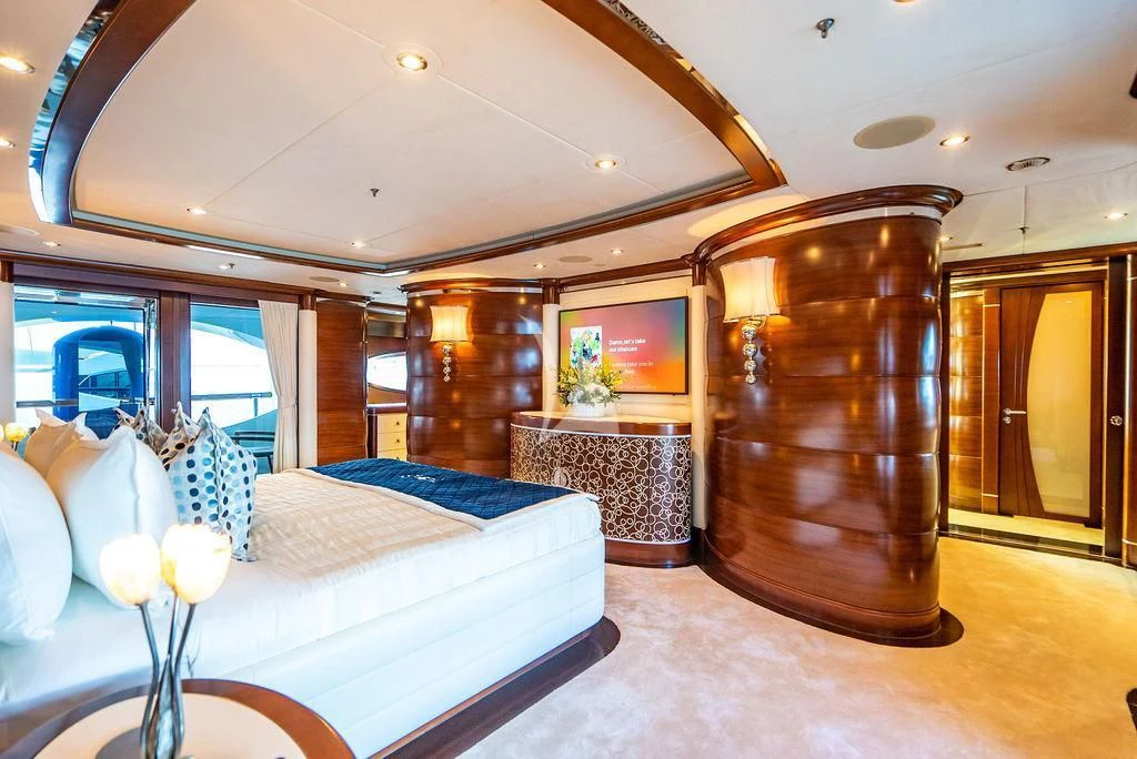 a large living room with a large mirror aboard LADY BRAVE Yacht for Sale