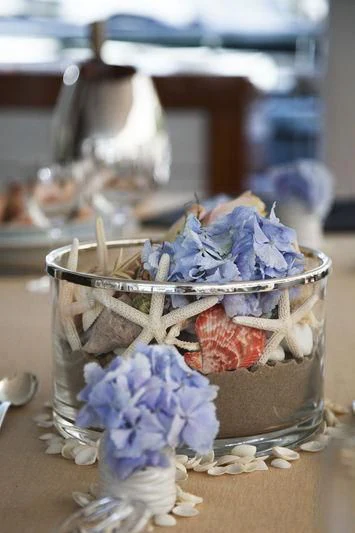 a cupcake with blue frosting and pink flowers aboard LADY BRAVE Yacht for Sale