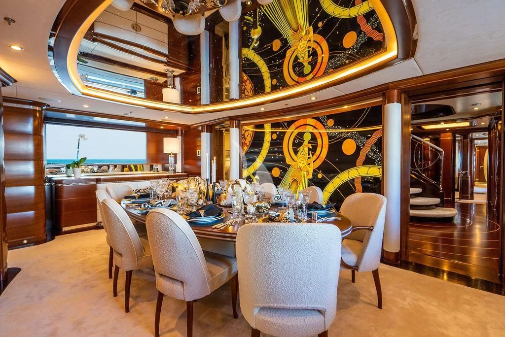 a large dining table in a large kitchen aboard LADY BRAVE Yacht for Sale
