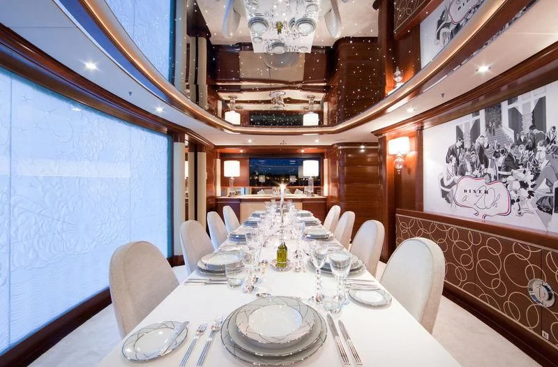 a dining room with a table set aboard LADY BRAVE Yacht for Sale