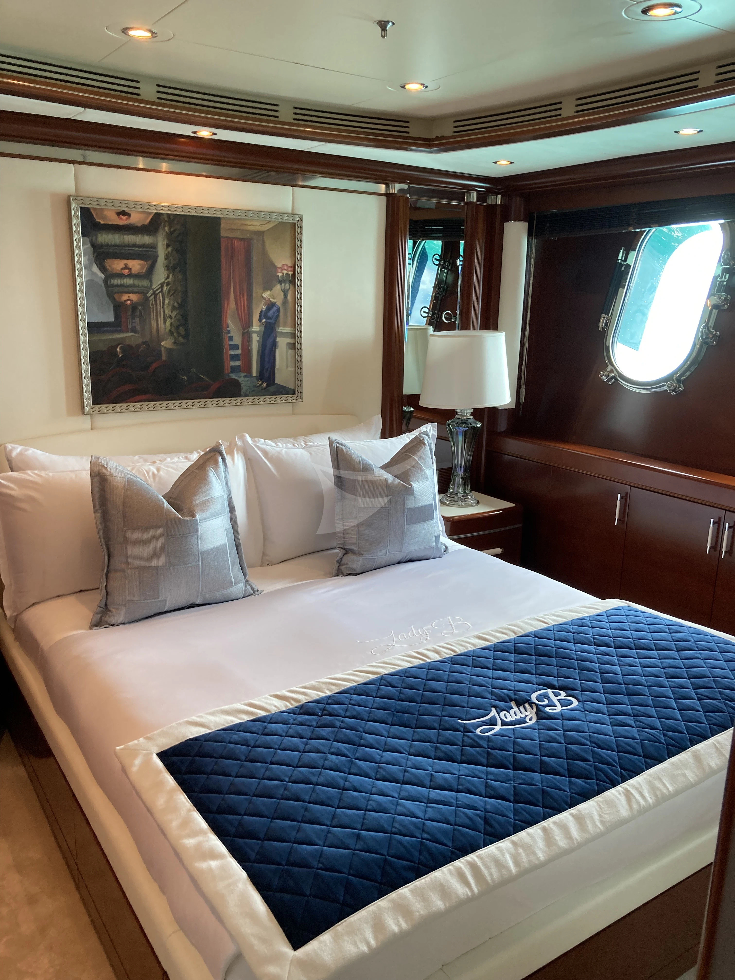 a room with a bed and a television aboard LADY BRAVE Yacht for Sale