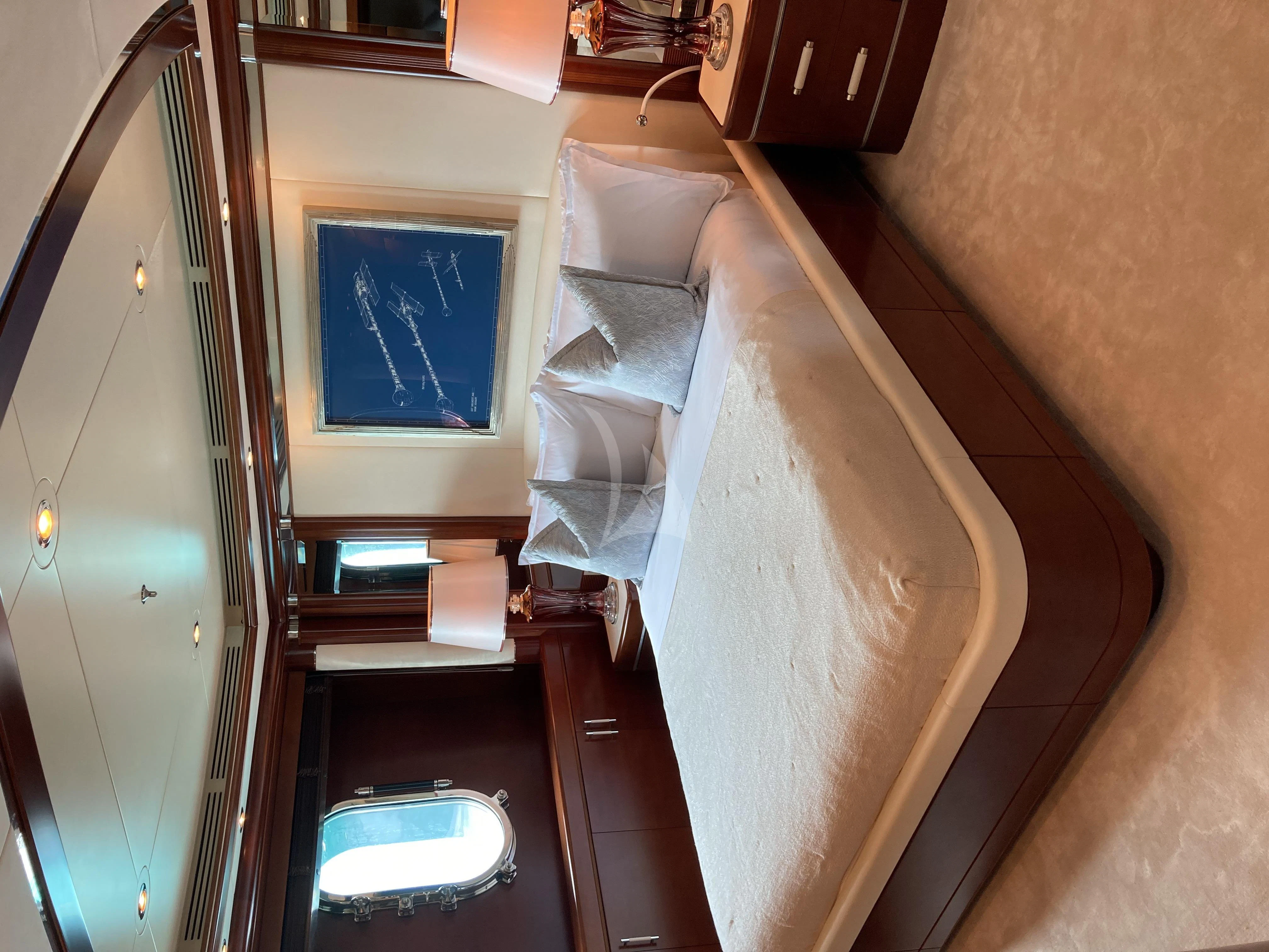 a room with a chair and a window aboard LADY BRAVE Yacht for Sale
