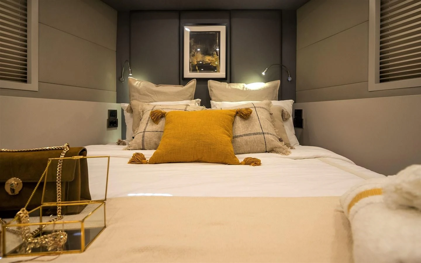 a bed with a white sheet and pillows aboard BERING B82 Yacht for Sale