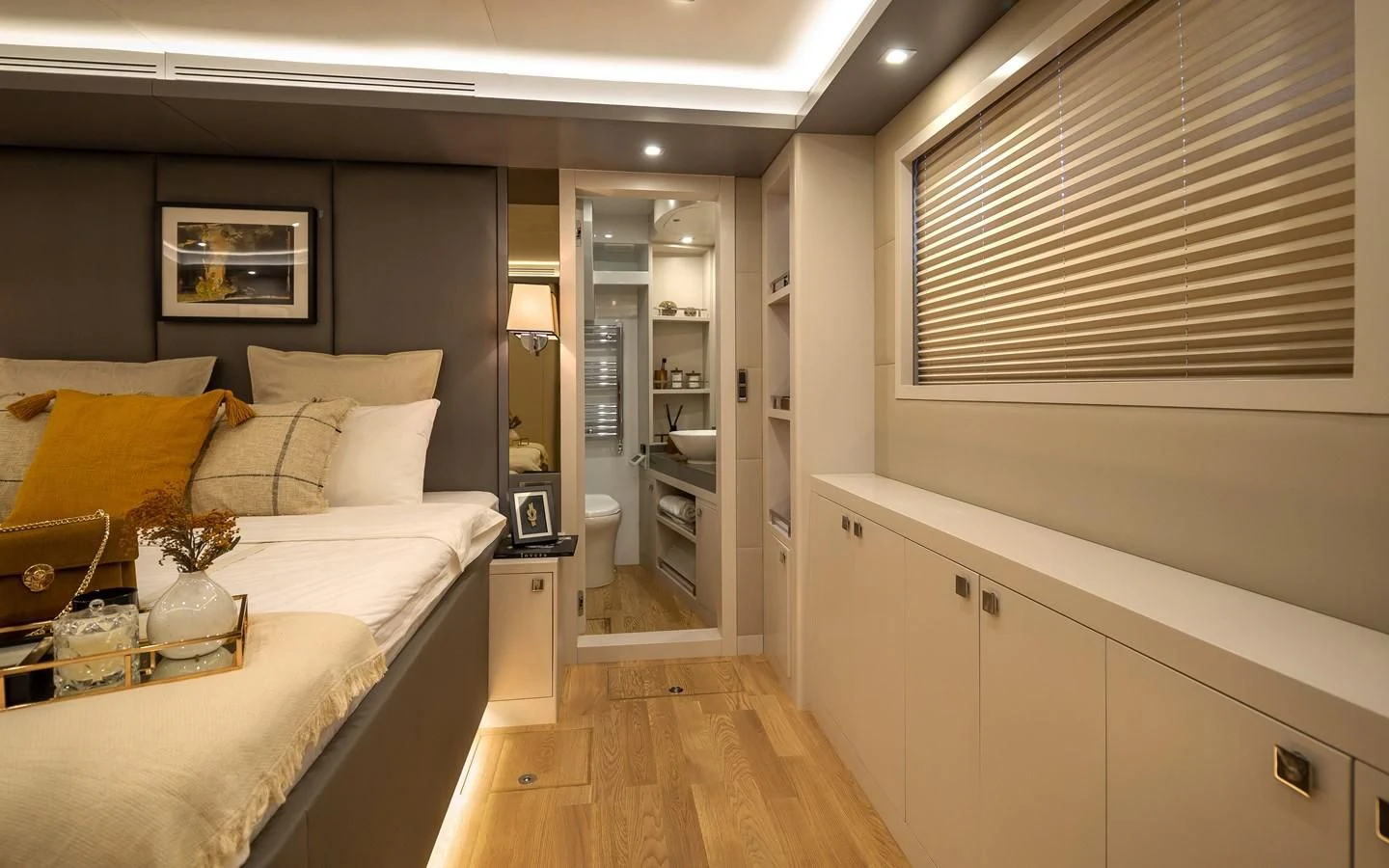 a bedroom with a bed and a desk aboard BERING B82 Yacht for Sale