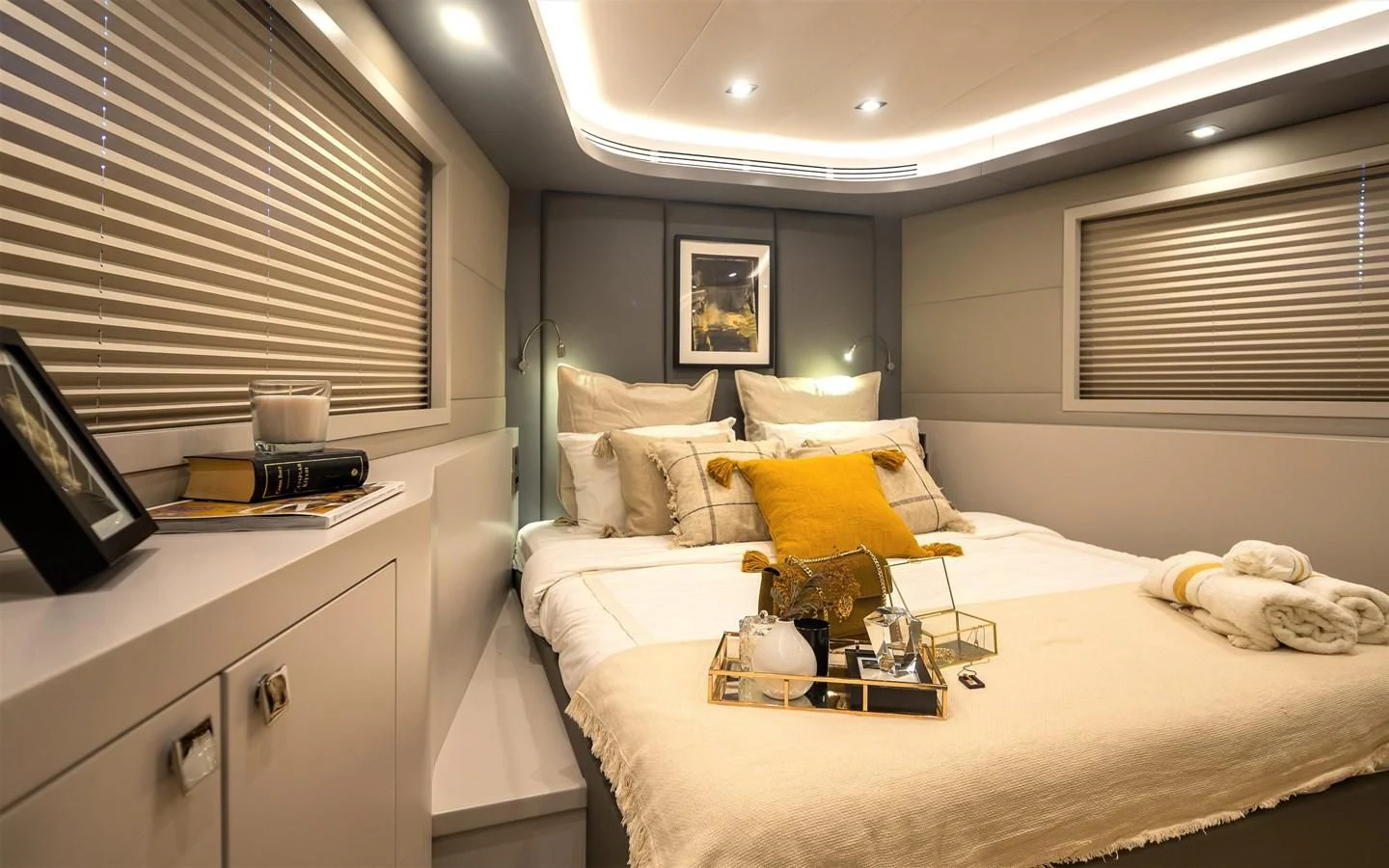 a bedroom with a bed and a desk aboard BERING B82 Yacht for Sale