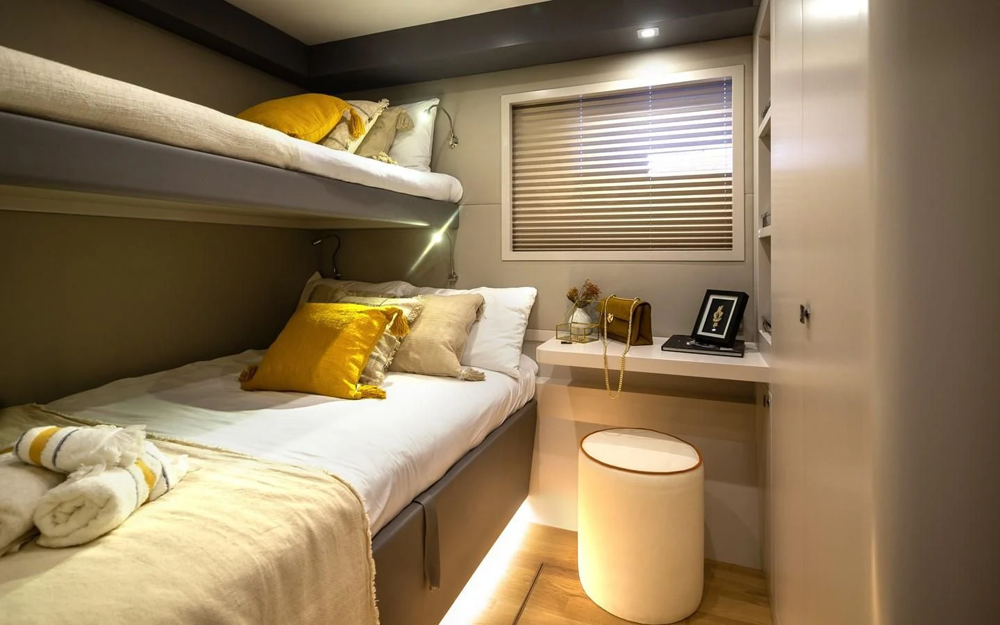 a bedroom with a bed and a desk aboard BERING B82 Yacht for Sale