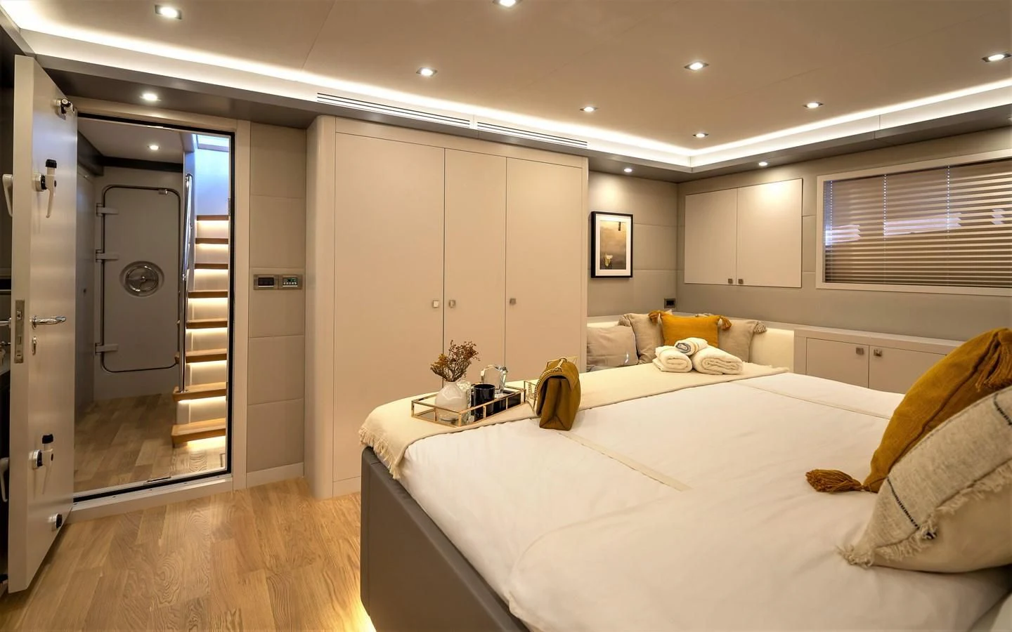 a room with a bed and a closet aboard BERING B82 Yacht for Sale
