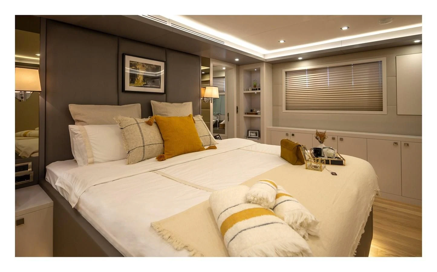 a bed with pillows on it aboard BERING B82 Yacht for Sale