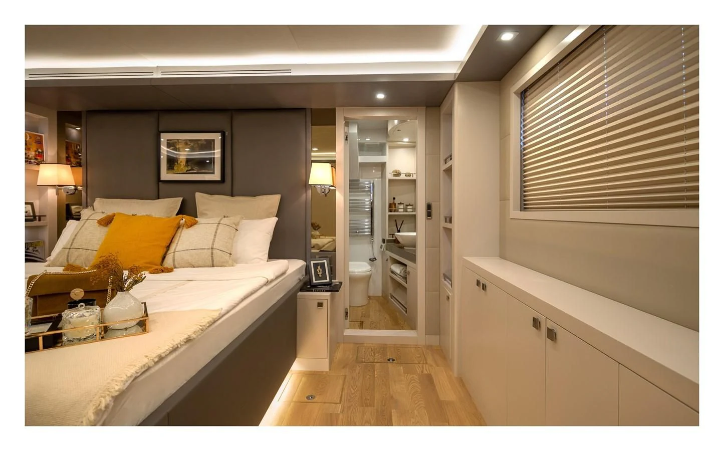 a bedroom with a bed and a desk aboard BERING B82 Yacht for Sale