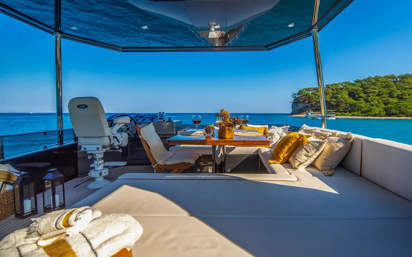 a table and chairs on a boat aboard BERING B82 Yacht for Sale