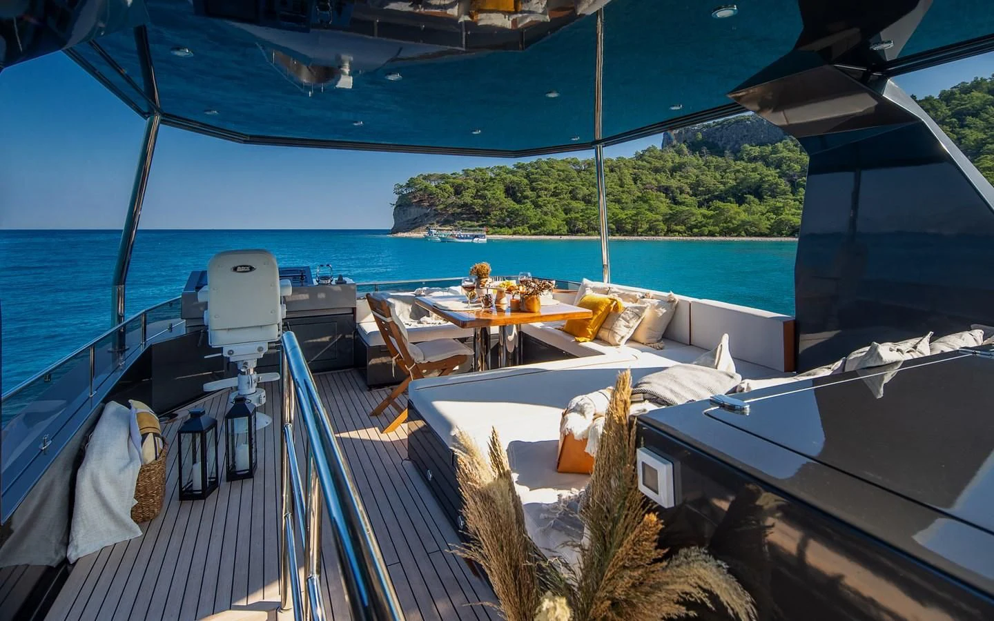 a deck with a view of the ocean and a beach aboard BERING B82 Yacht for Sale