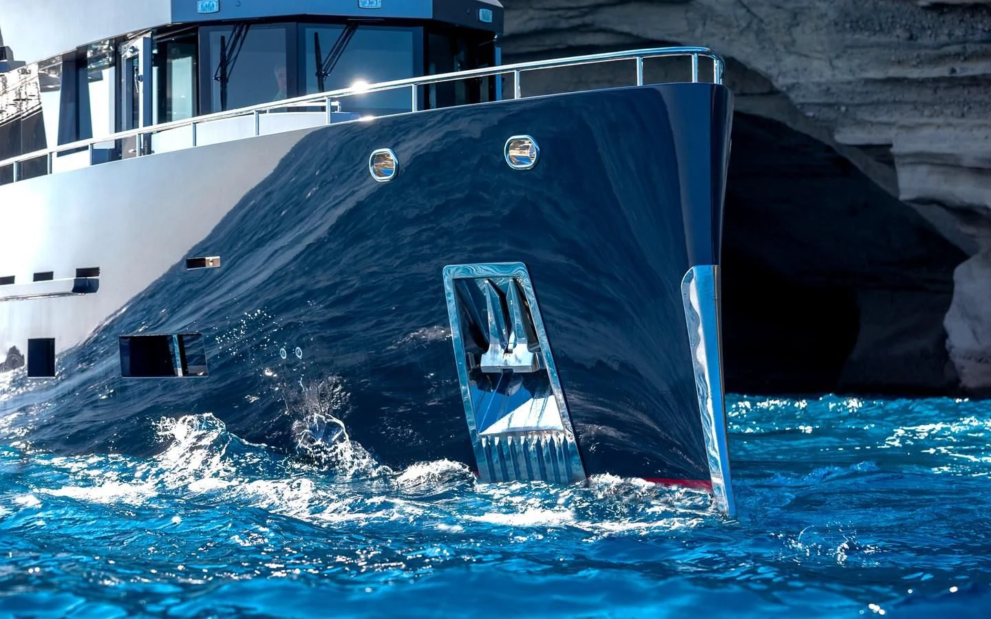 a large blue submarine in the water aboard BERING B82 Yacht for Sale