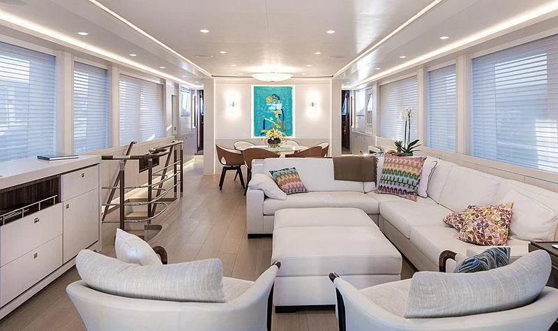 a living room with white furniture aboard VANADIS Yacht for Sale