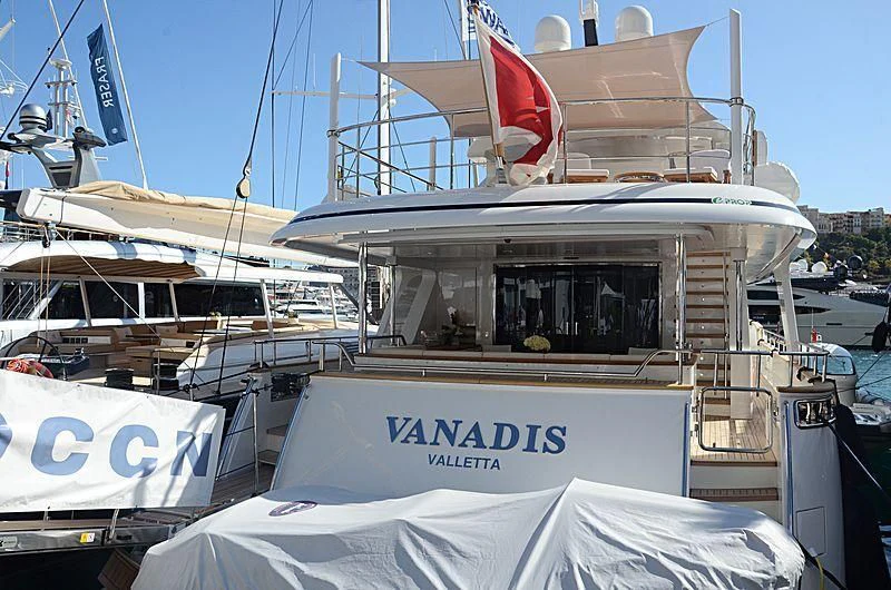a boat with a flag on the front aboard VANADIS Yacht for Sale