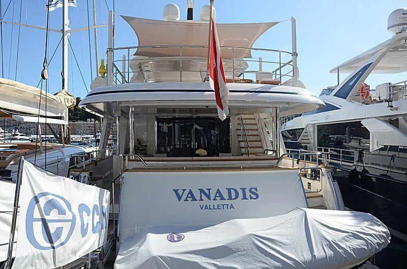 a boat with a flag on the front aboard VANADIS Yacht for Sale