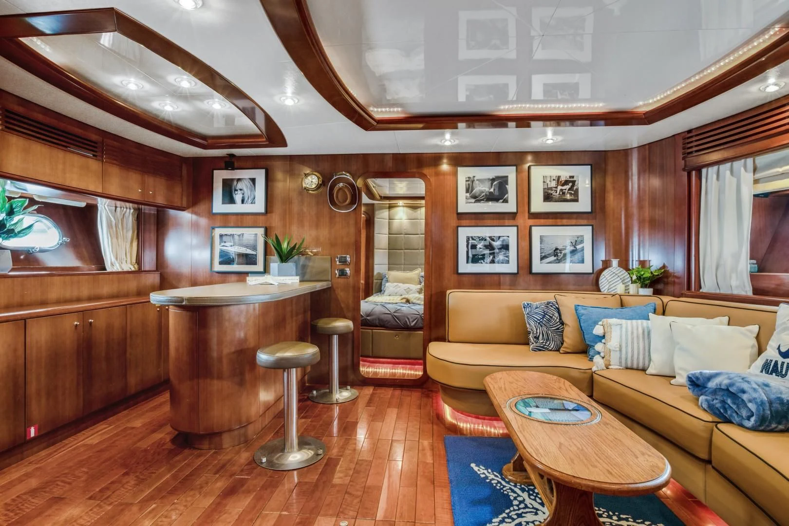 a living room with a couch and a table aboard ALCHEMY Yacht for Sale