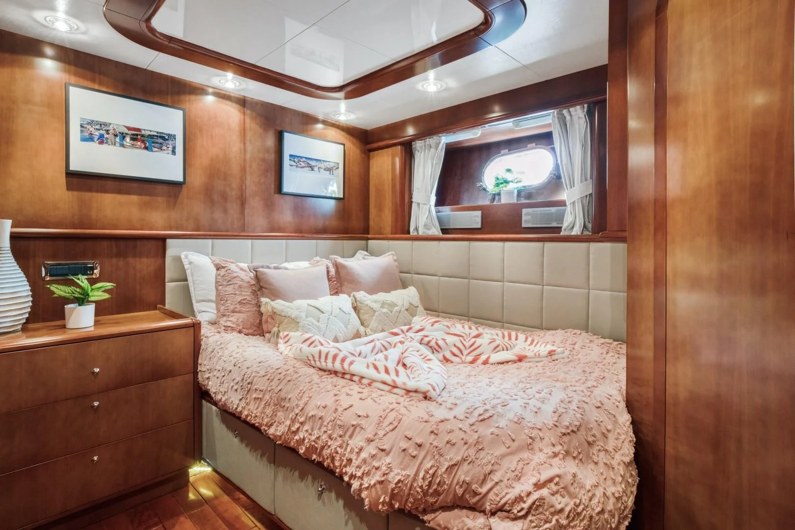 a bed with a flower on the bed aboard ALCHEMY Yacht for Sale