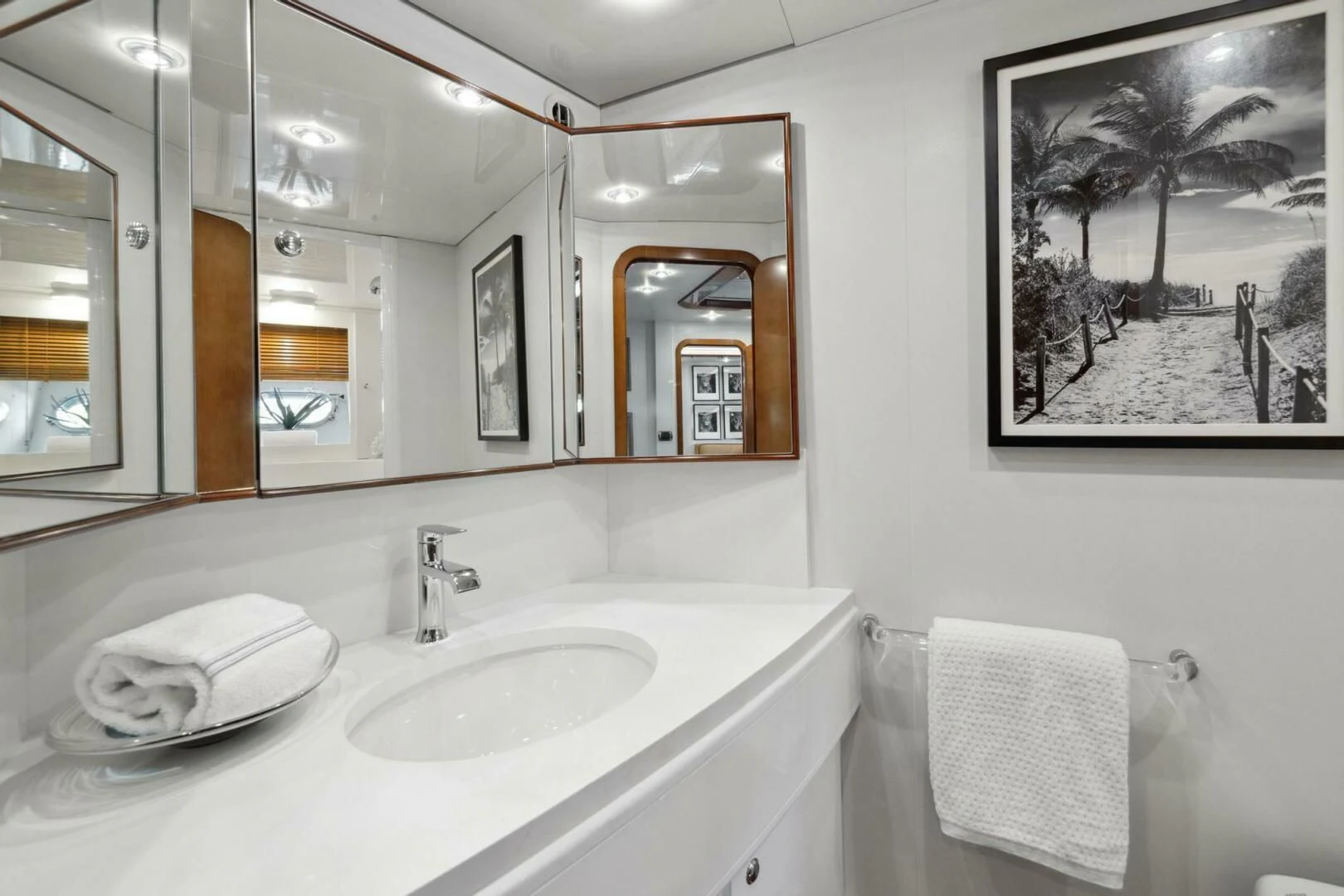 a bathroom with a sink and mirror aboard ALCHEMY Yacht for Sale
