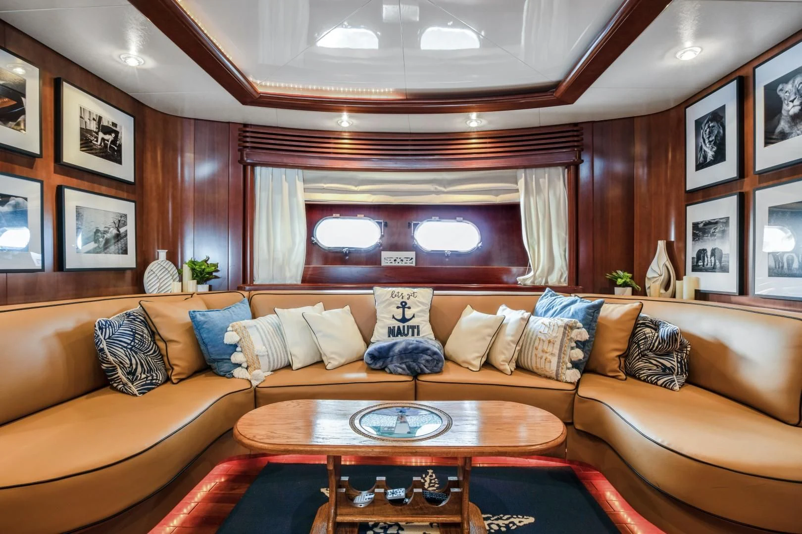 a living room with a couch and a table aboard ALCHEMY Yacht for Sale
