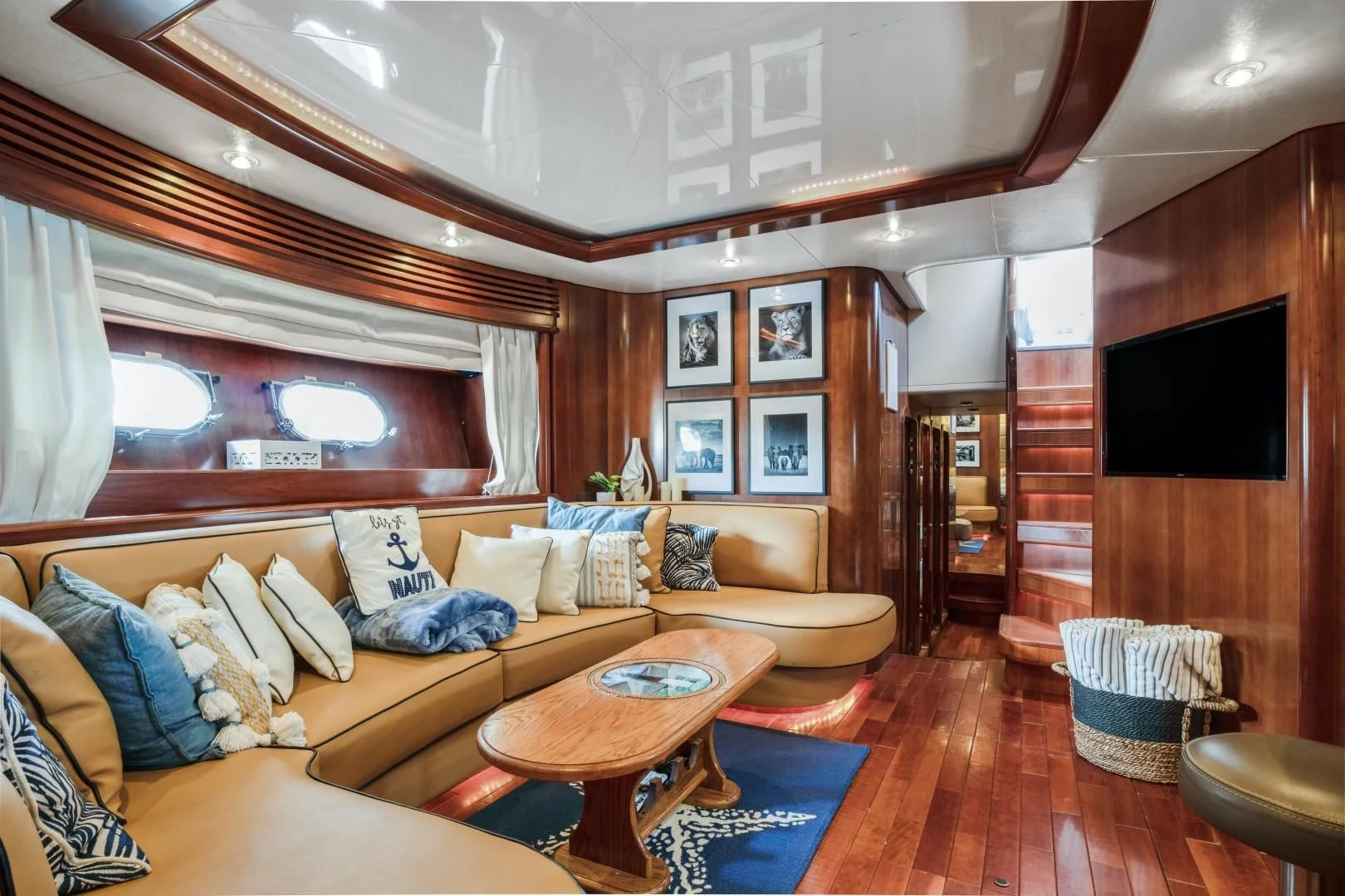 a living room with a wood floor aboard ALCHEMY Yacht for Sale